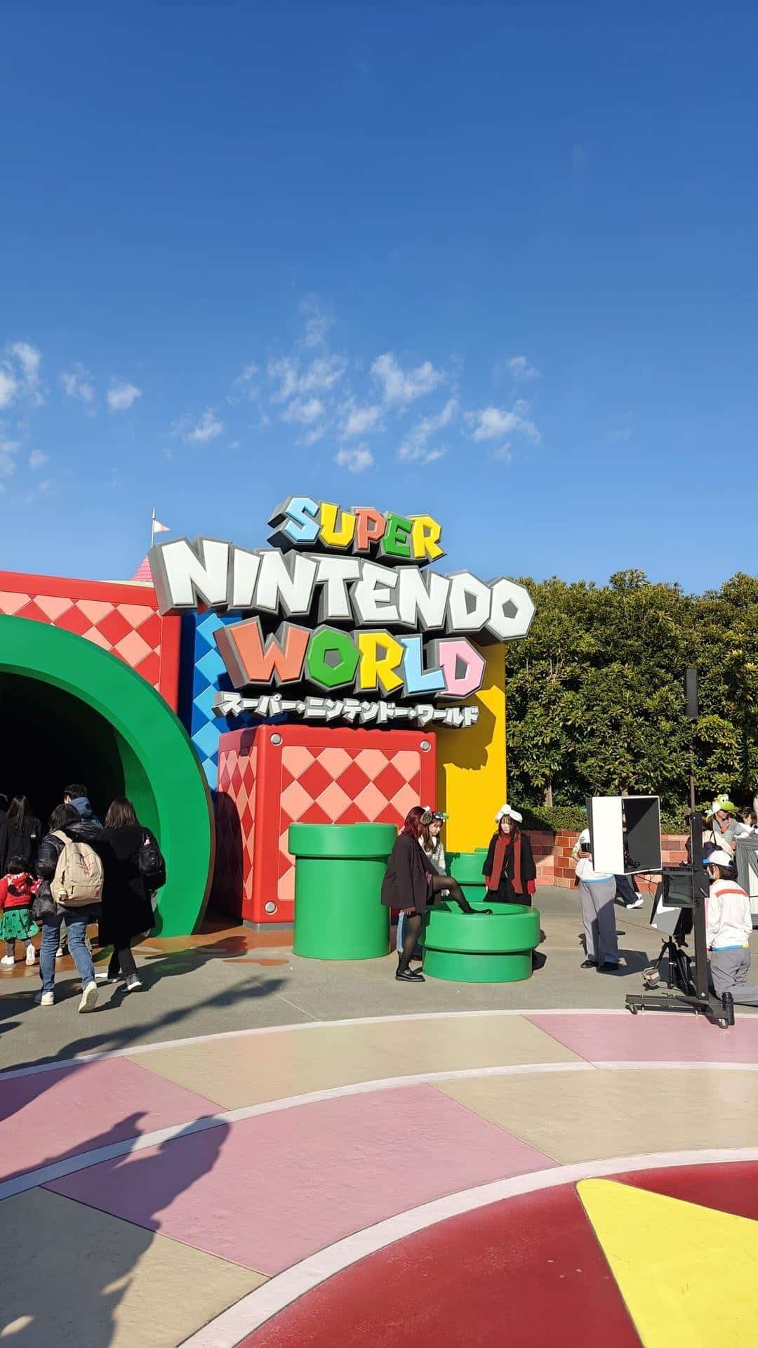 Super Nintendo World entrance with visitors