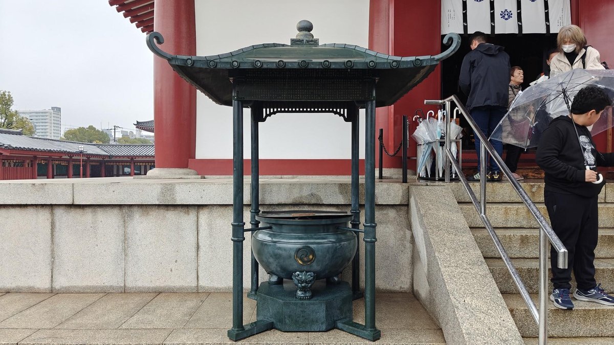 Temple courtyard with copper urn
