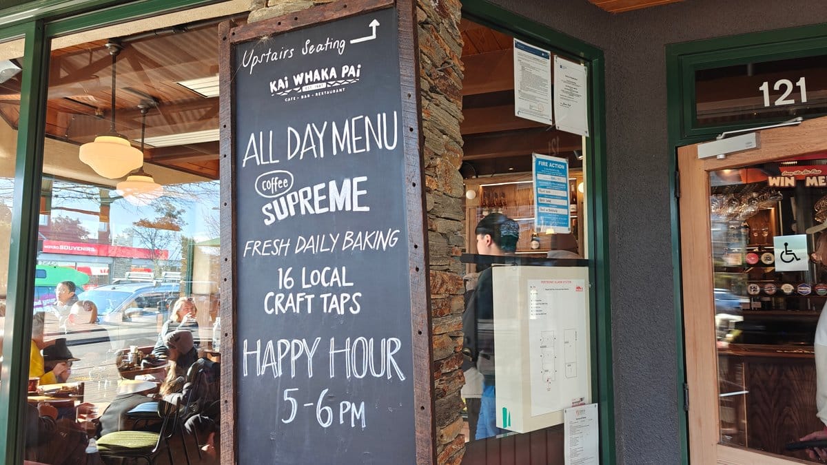 The A-frame chalkboard: 'KAI WHAKA PAI - All