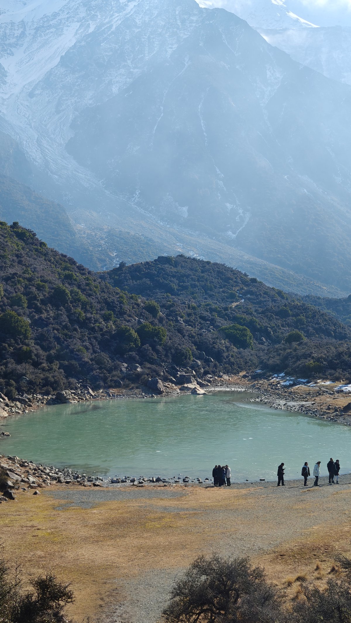 The Blue Lake tarn with the hazy mountainside