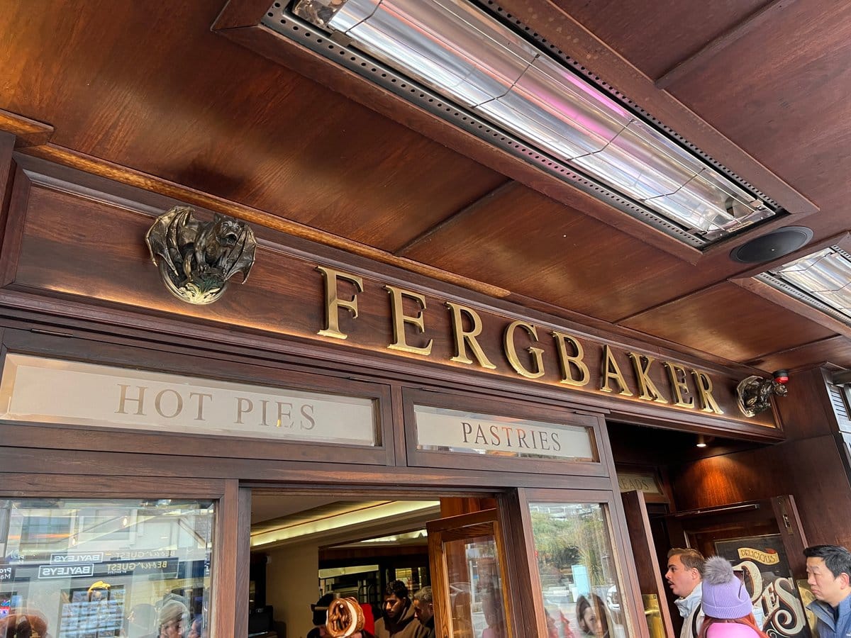 The Fergbaker shopfront: warm-lit timber facade with gold