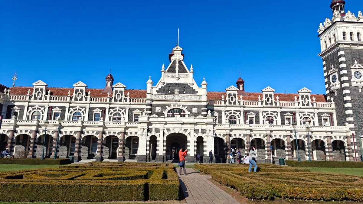 The full station facade seen across the formal