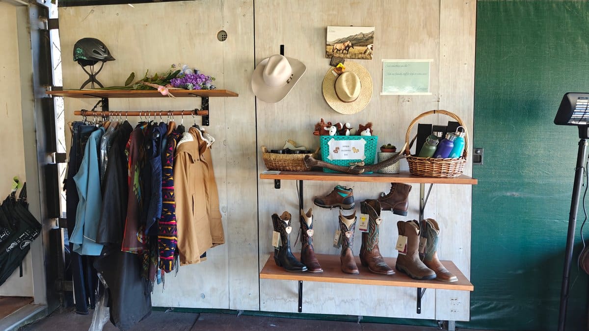The hire/retail corner of the tent: a rack
