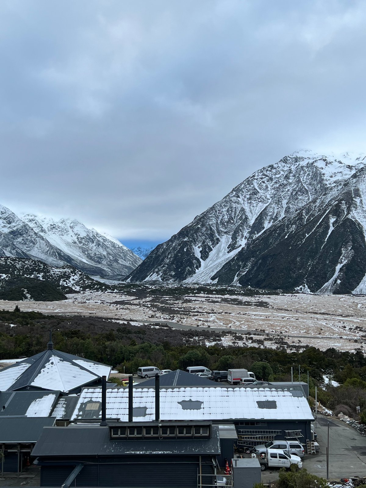 The snowy mountains with the wide valley opening