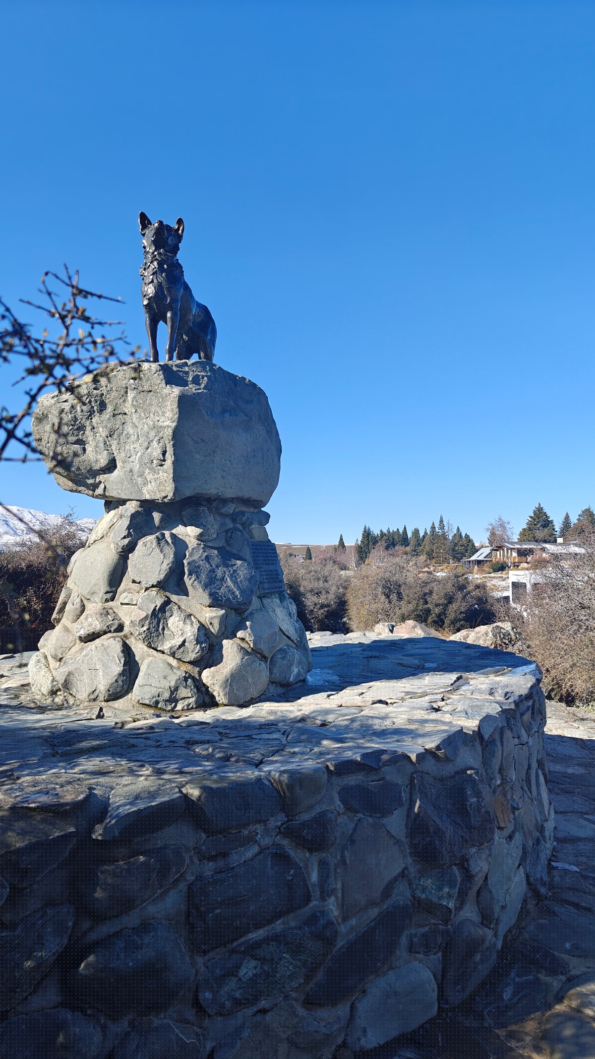 The statue seen from the side/rear, showing the