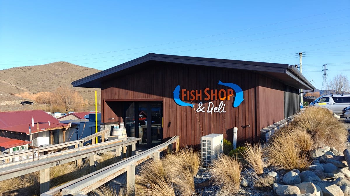 The timber-clad Fish Shop building. Large wall sign