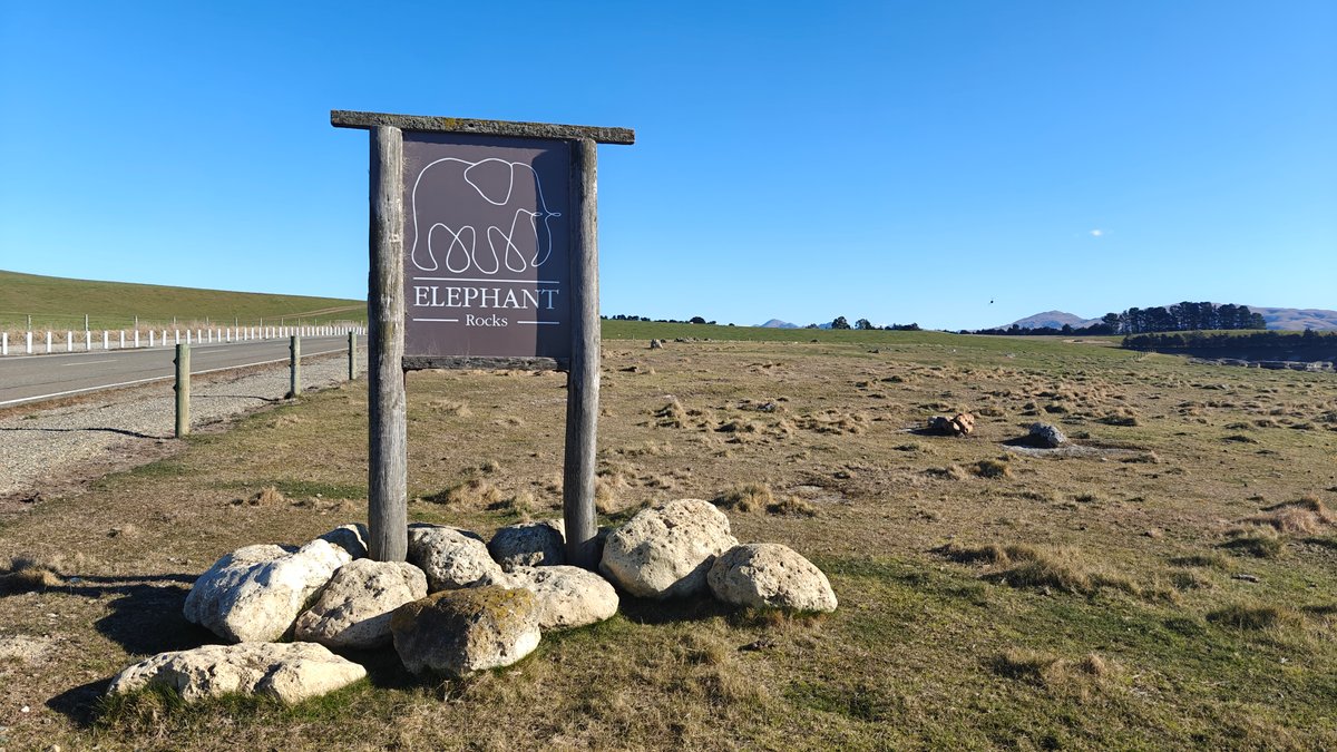 The weathered wooden entrance sign 'ELEPHANT Rocks' with