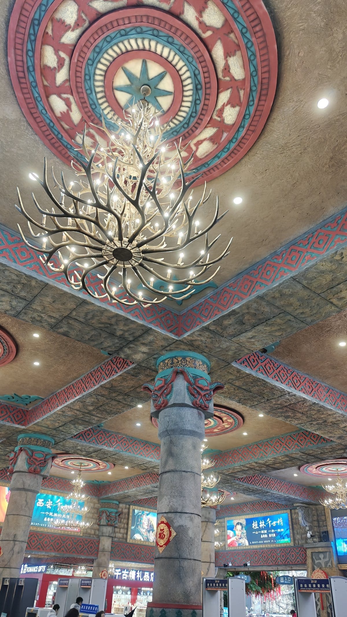 Ticket hall interior with ornate ceiling medallion, antler