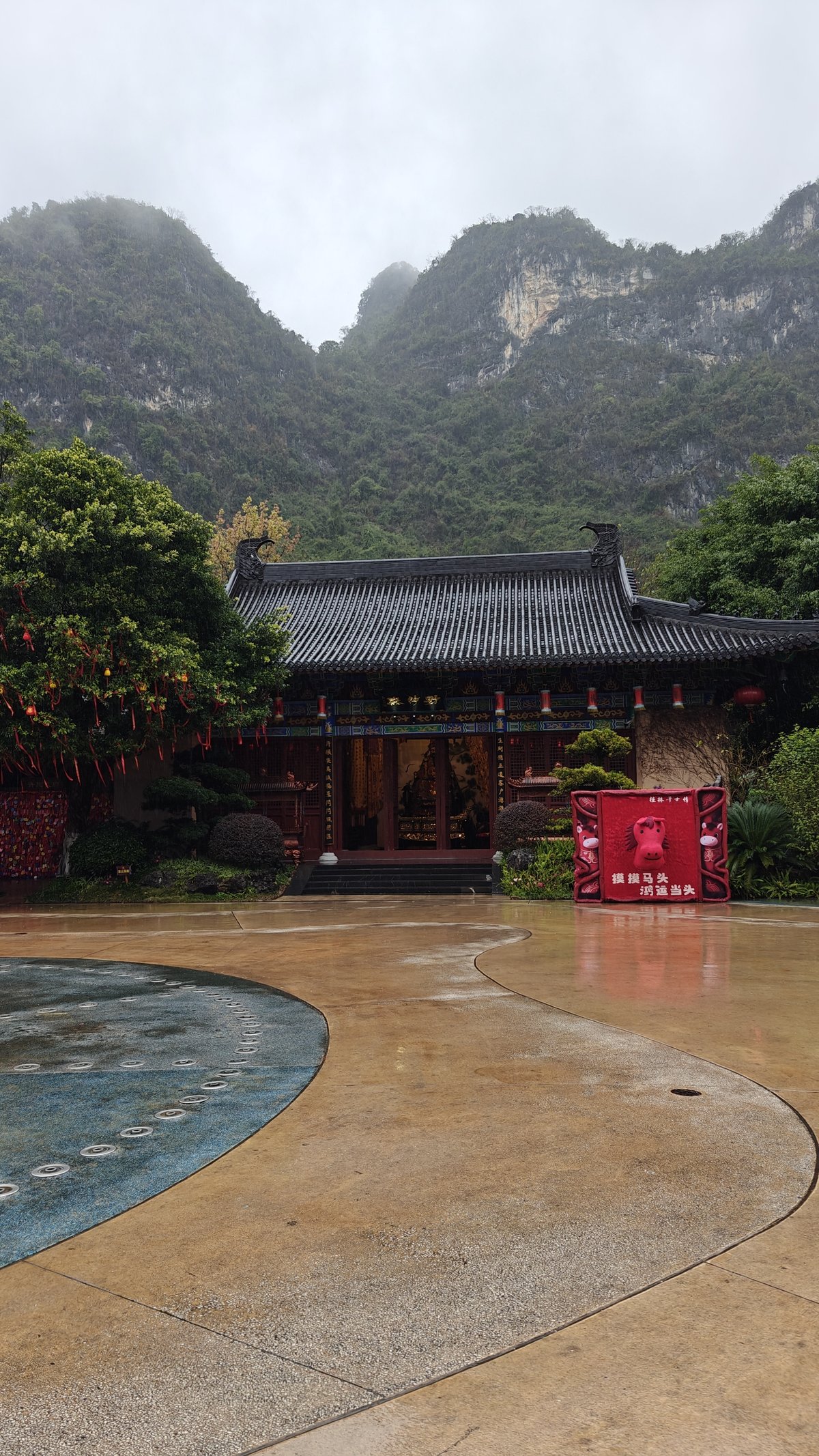 Traditional Chinese pavilion with ornate roof and karst