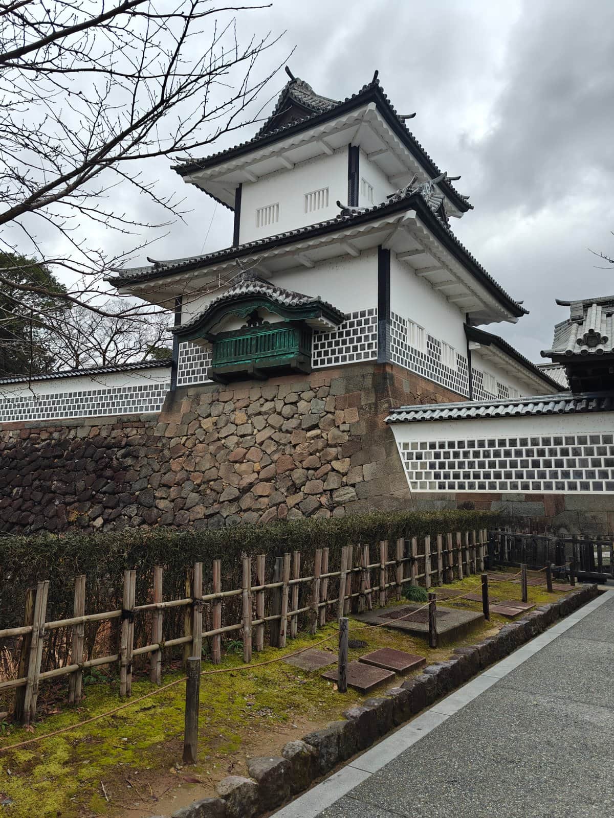 Turret rising above stone walls