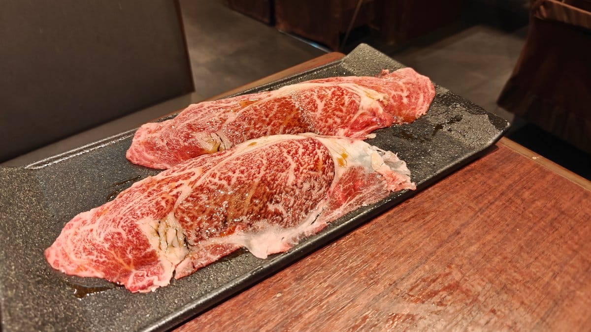 Two large raw beef steaks