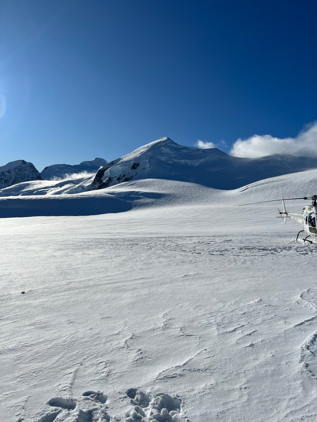 Vast snowfield and helicopter
