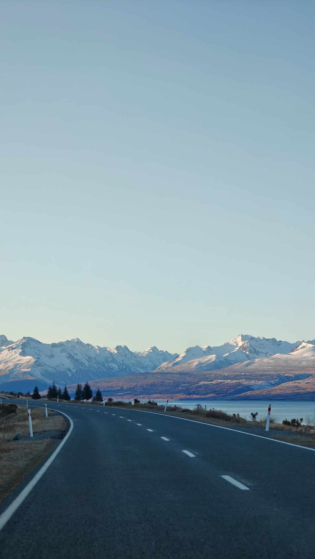 Vertical view of the highway curving toward snow