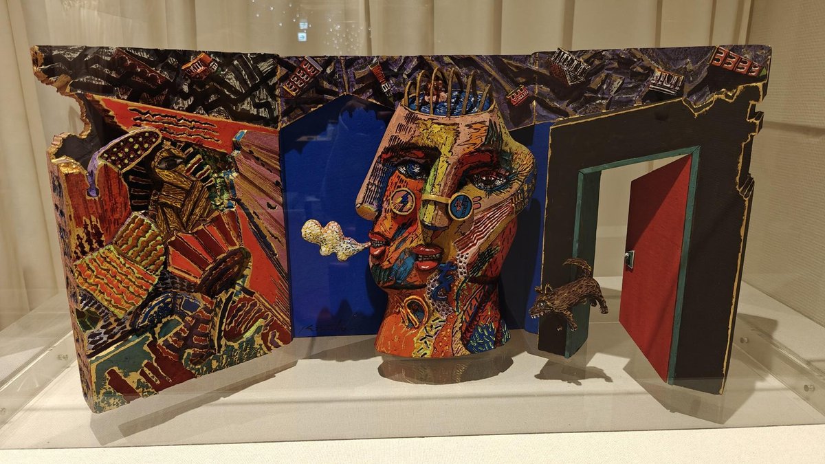 Vibrant abstract sculpture with faces
