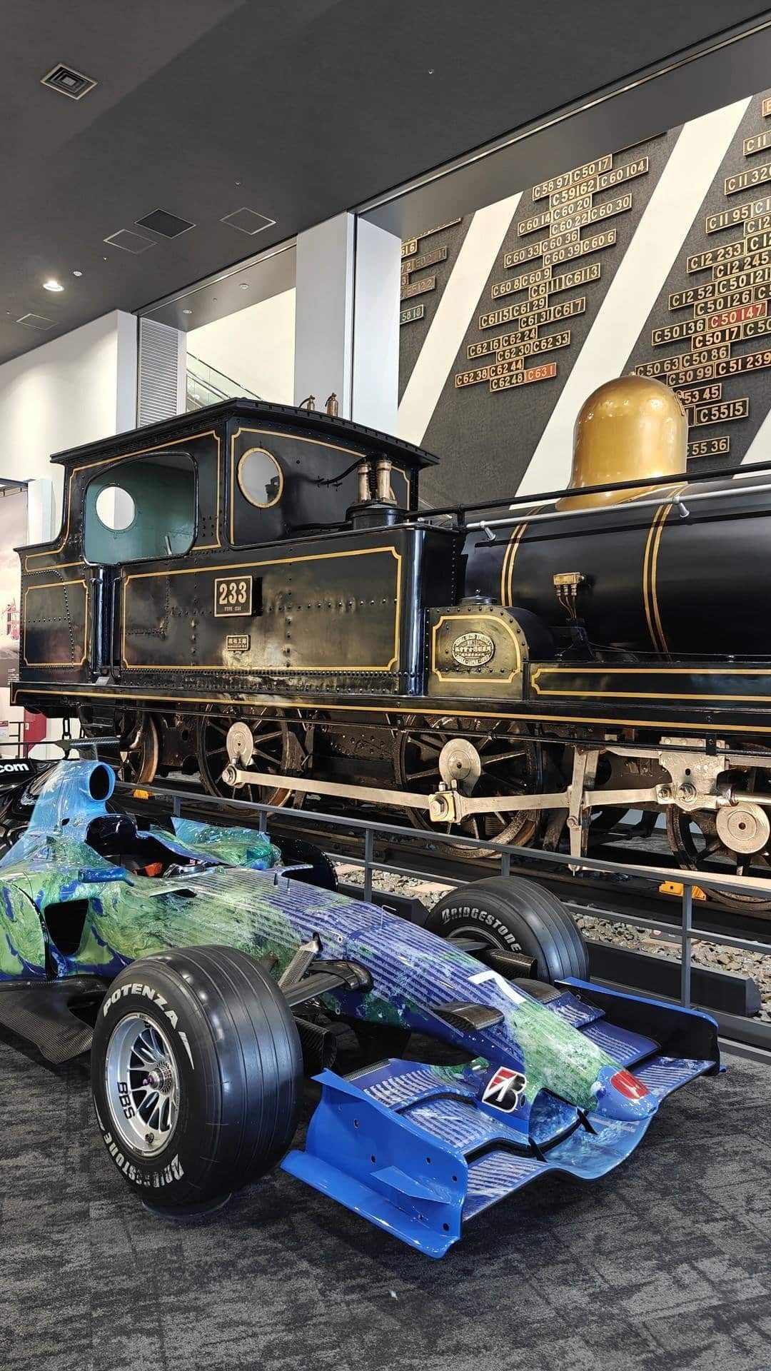 Vintage train with modern race car