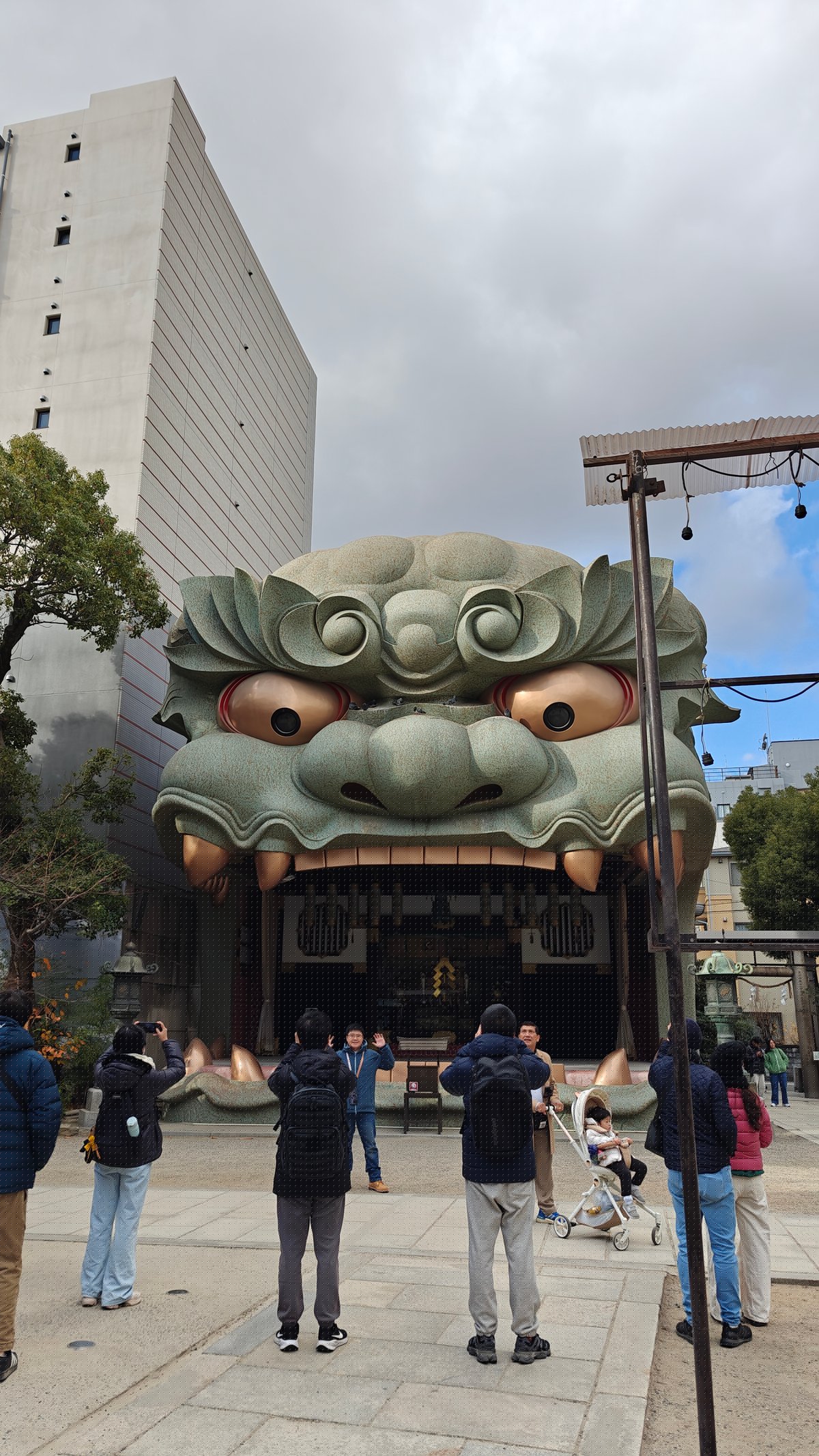 Visitors at lion head shrine