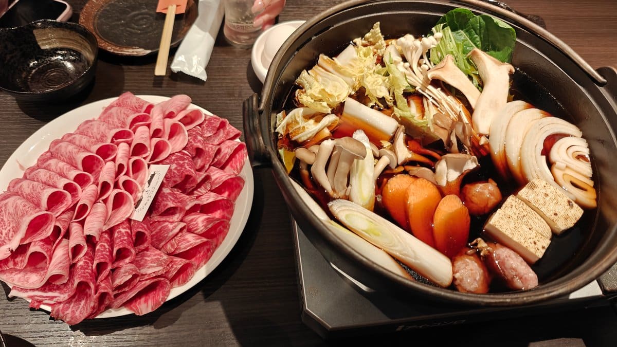 Wagyu plate beside hot pot