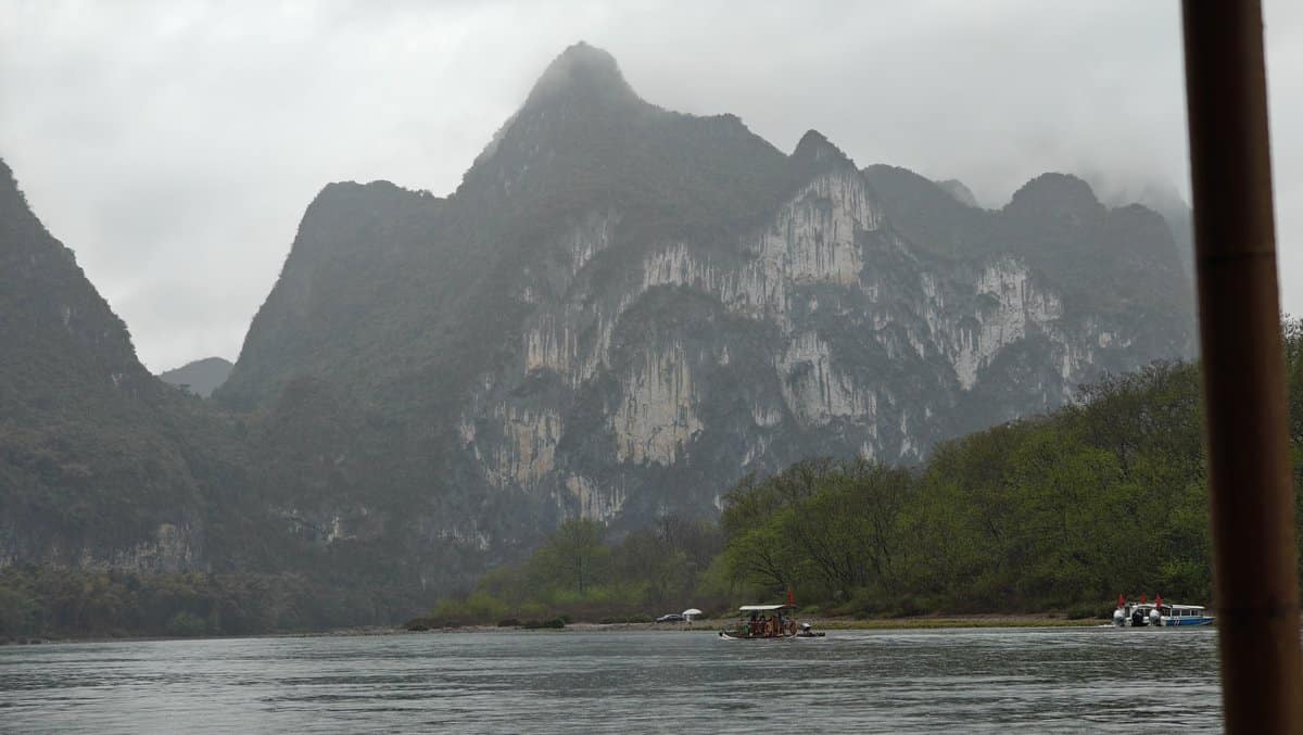 White cliff face and river rafts