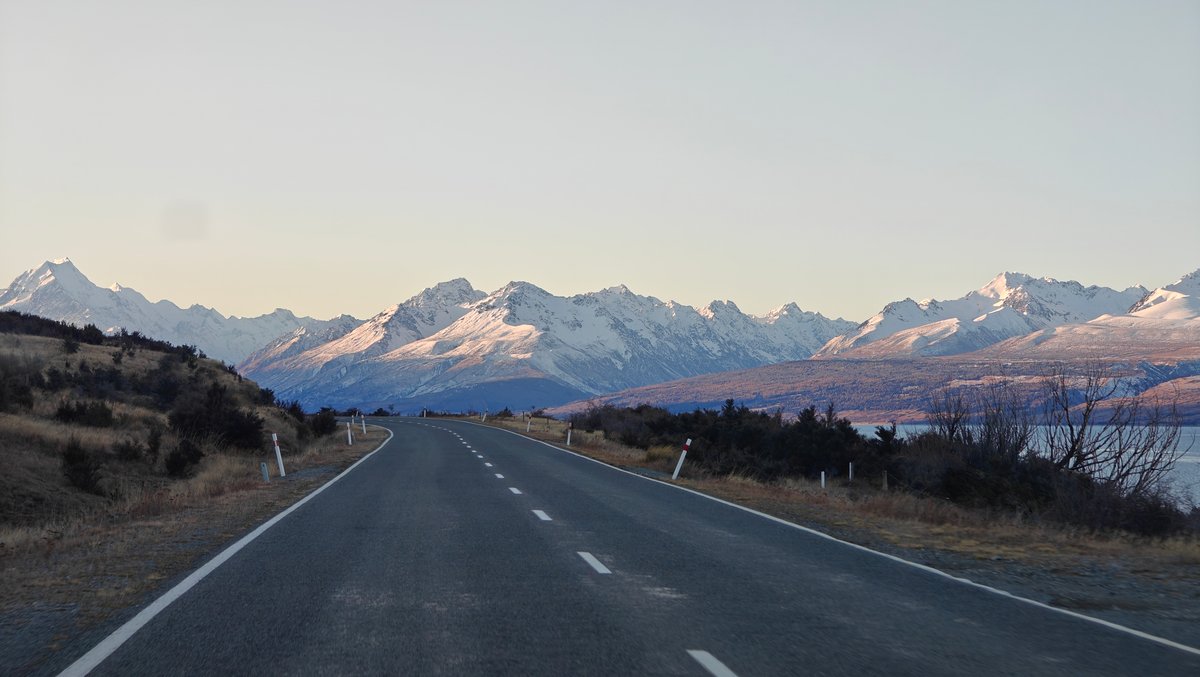 Wide dusk view down the road toward a