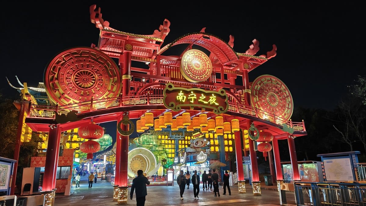Wide red gate with bronze drums