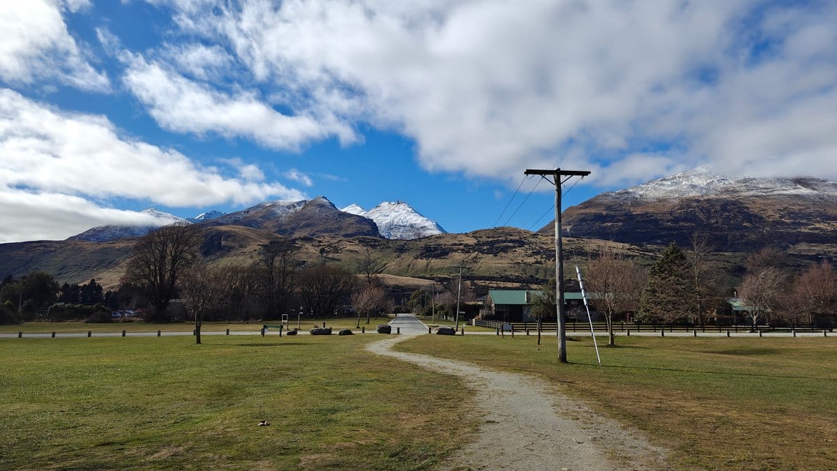 Wide view across the grassy lakeside reserve with