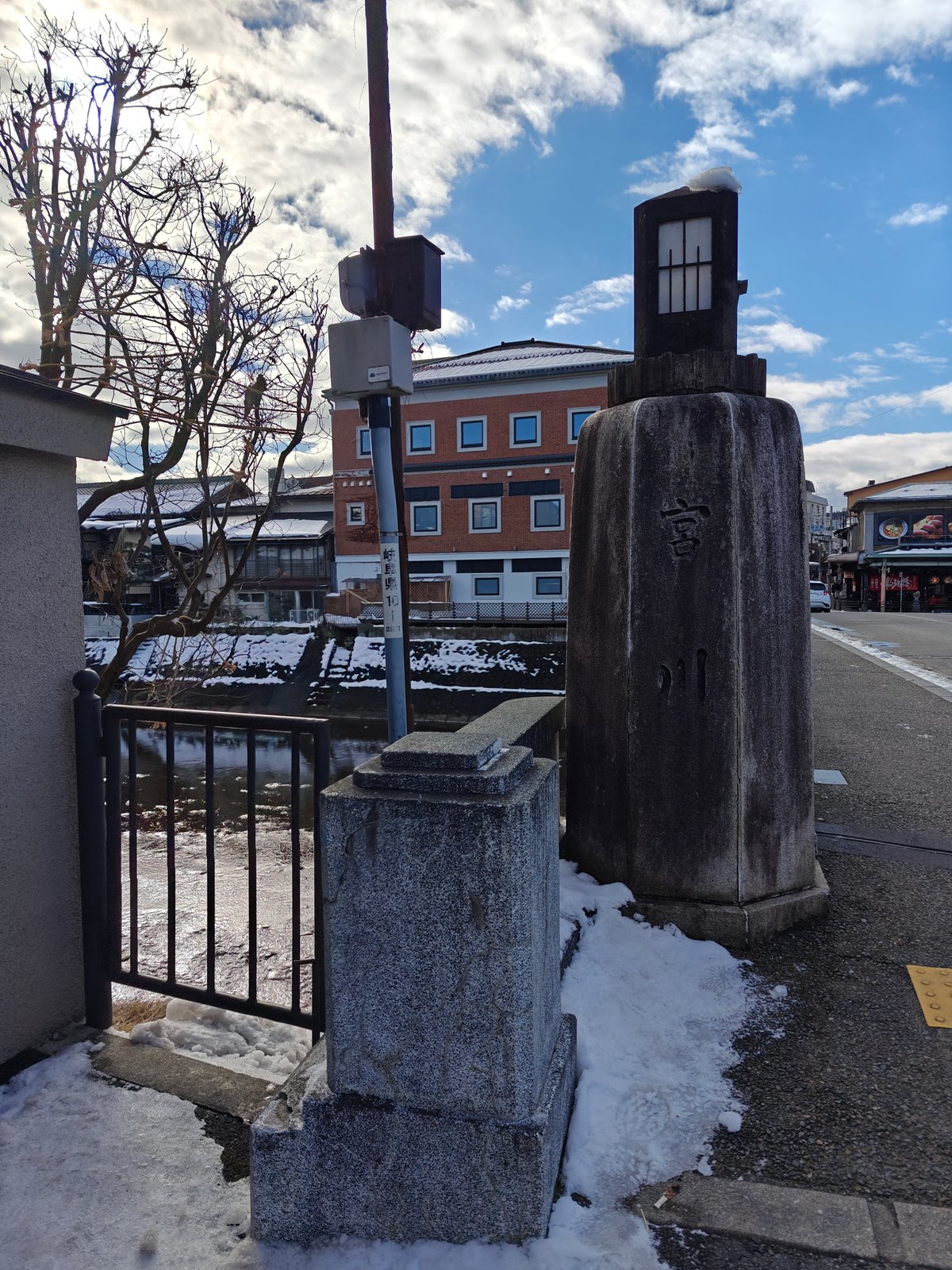 A bridge-corner stone post carved 宮川 (Miyagawa, the