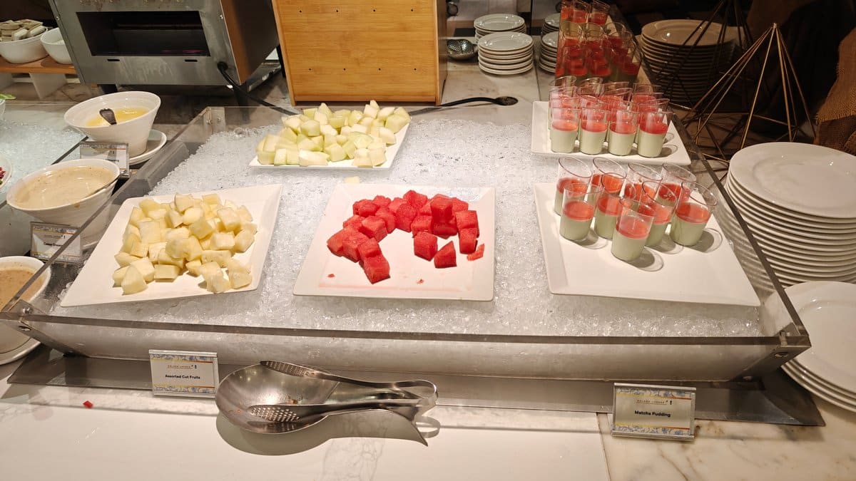 Assorted cut fruits on ice