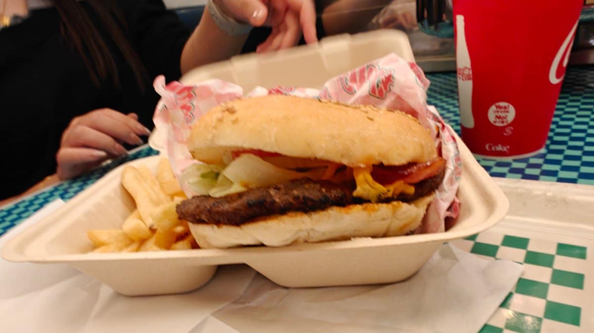 BBQ Bacon Cheeseburger meal side view showing layers