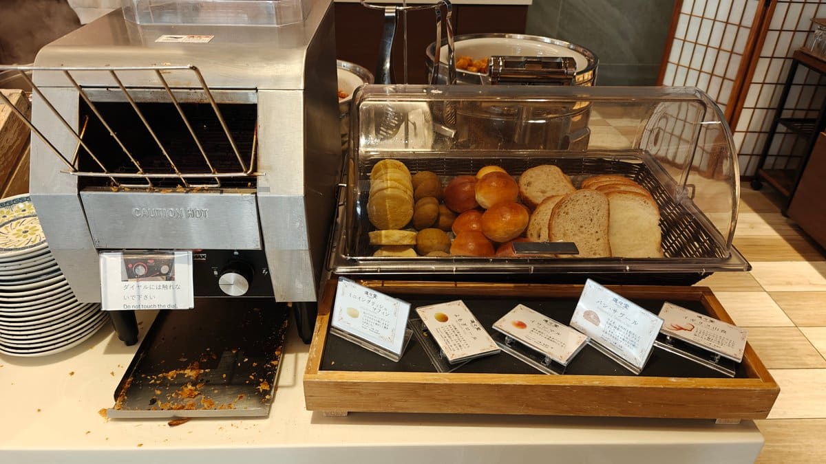 Buffet bread station with a toaster and pastries