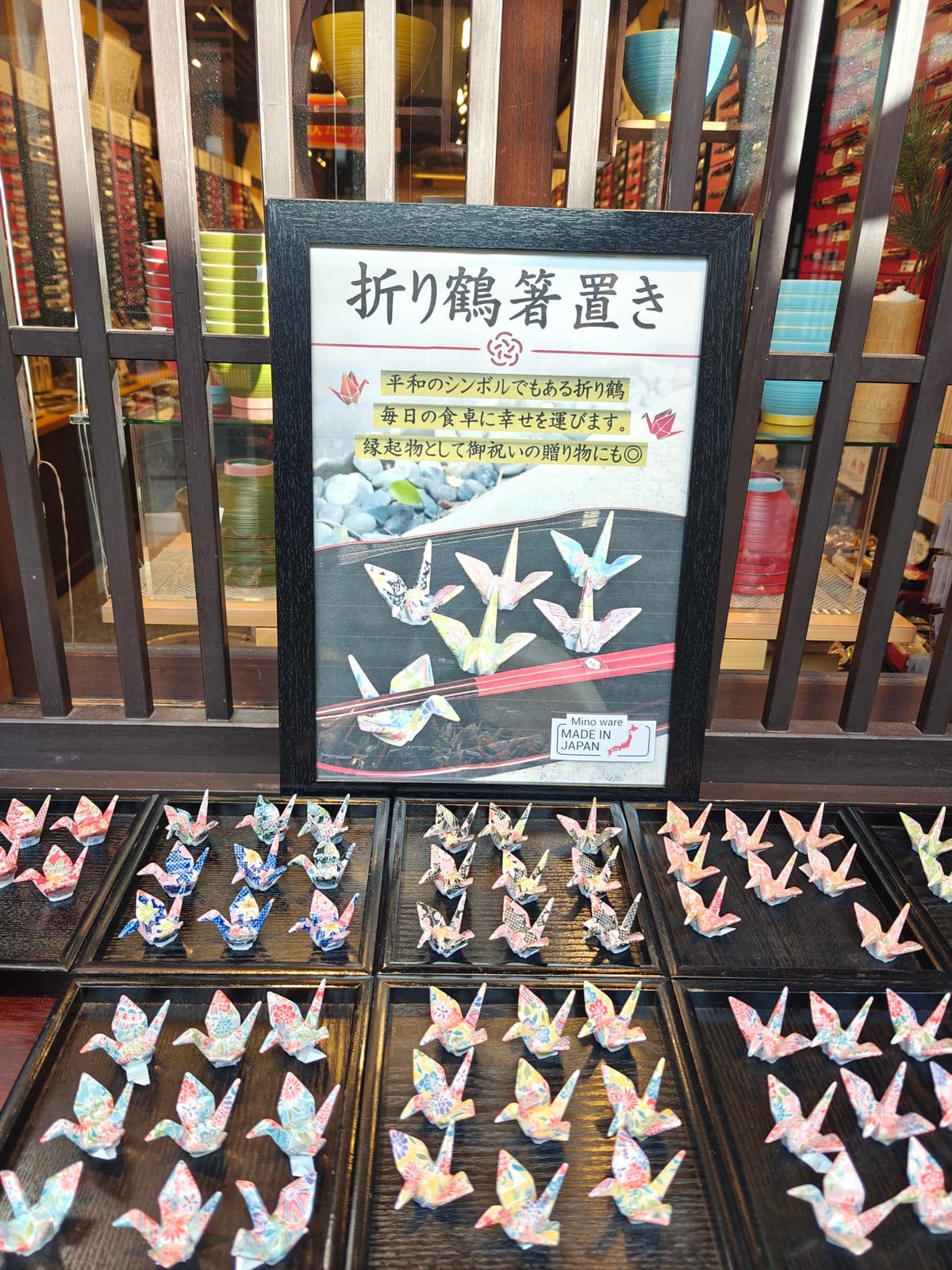 Close-up of the chopstick shop's 折り鶴箸置き display: a