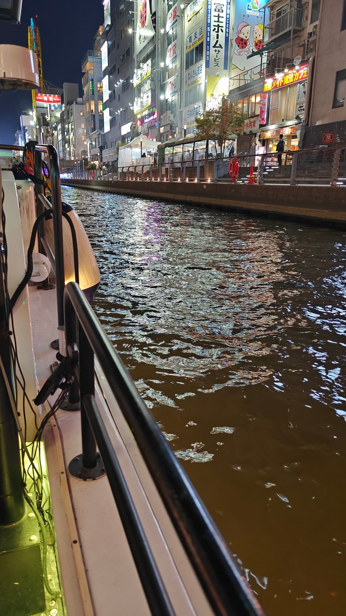 Cruising Dotonbori canal neon banks