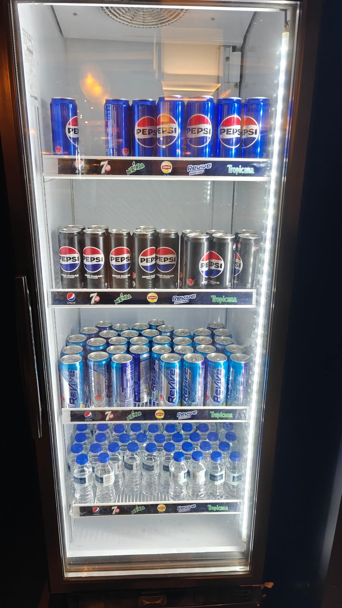 Drinks chiller stocked with Pepsi, Pepsi Zero Sugar,