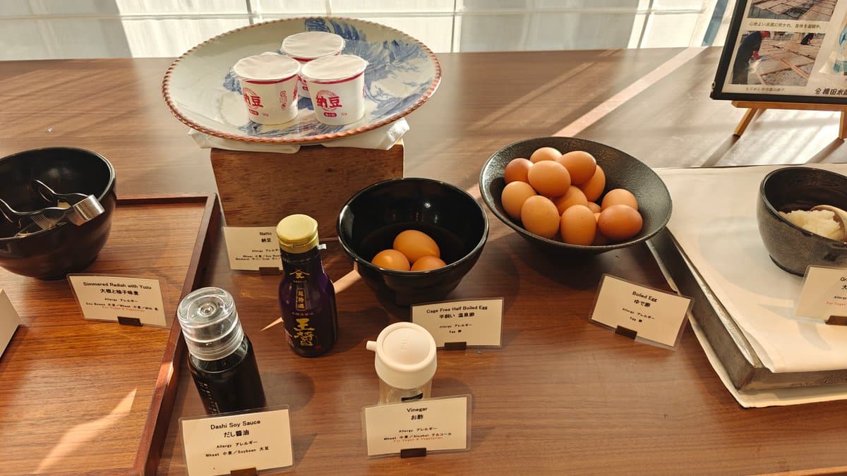 Eggs and condiments station with bowls of raw