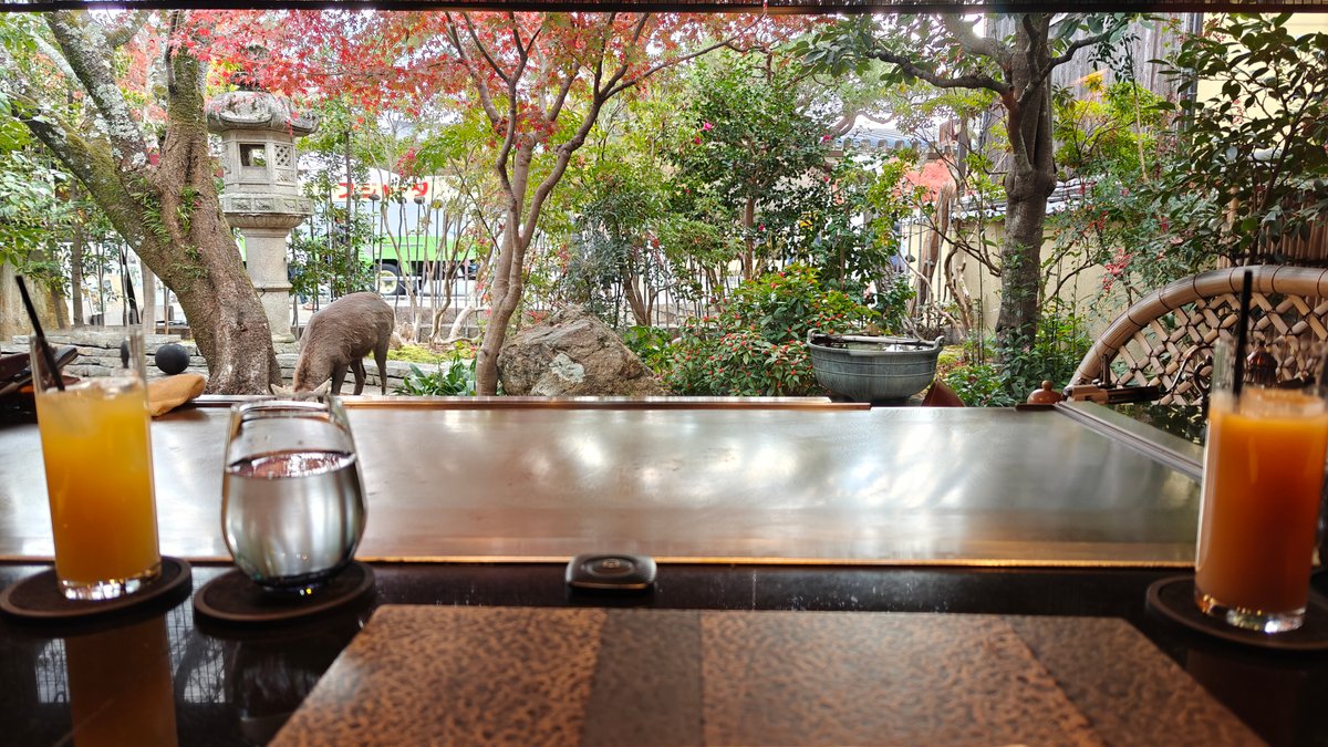 Fish teppanyaki plated with garnish, sauce being added