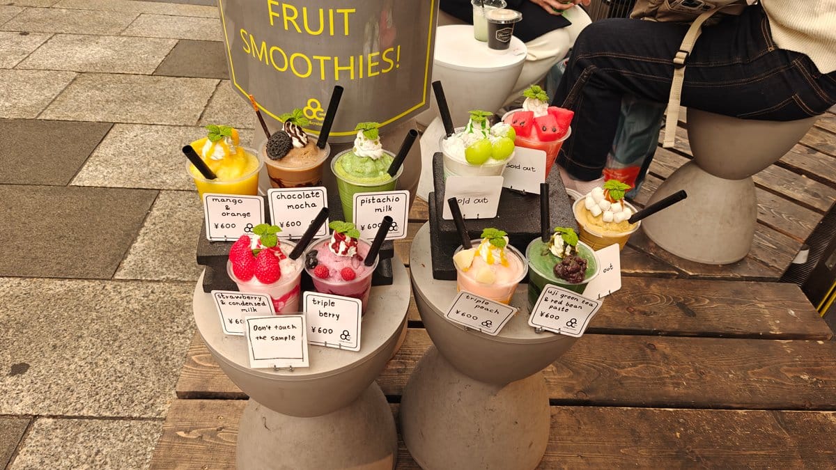 Fruit smoothie sample display on concrete pedestals —