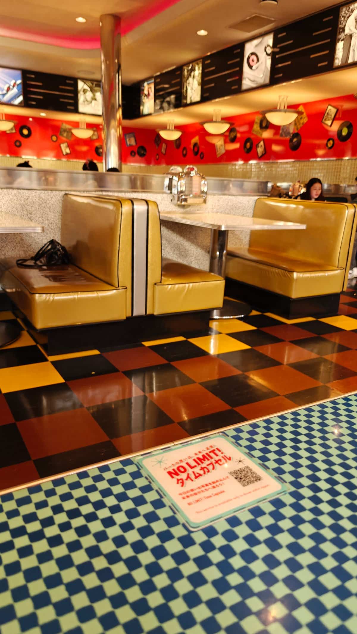 Gold booth seating with vinyl records on red