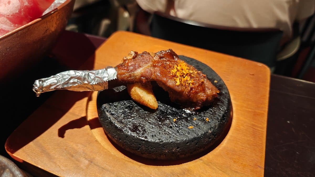 Grilled lamb chop on stone