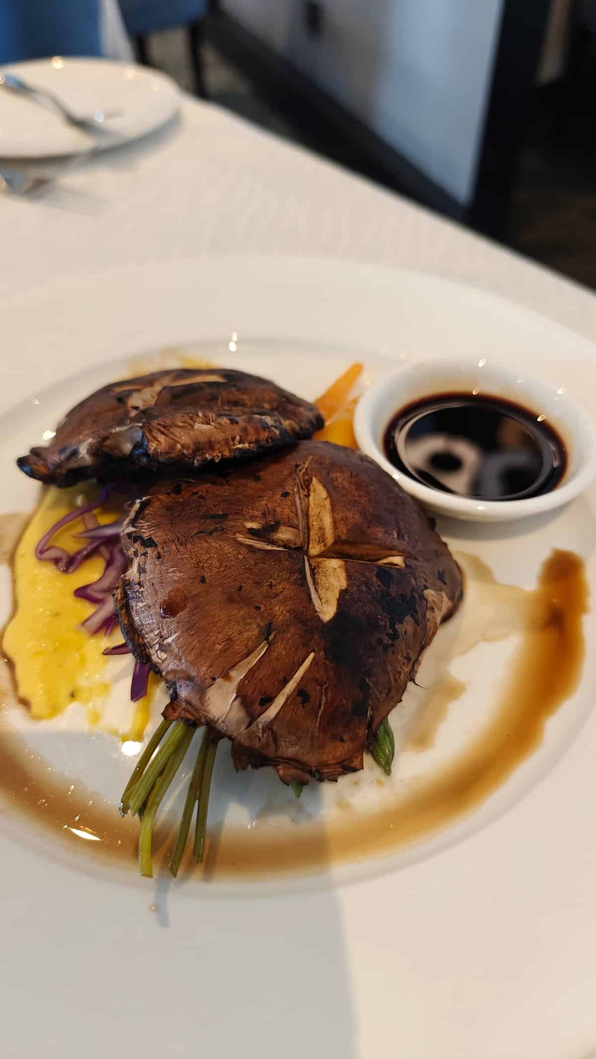 Grilled portobello over pumpkin puree