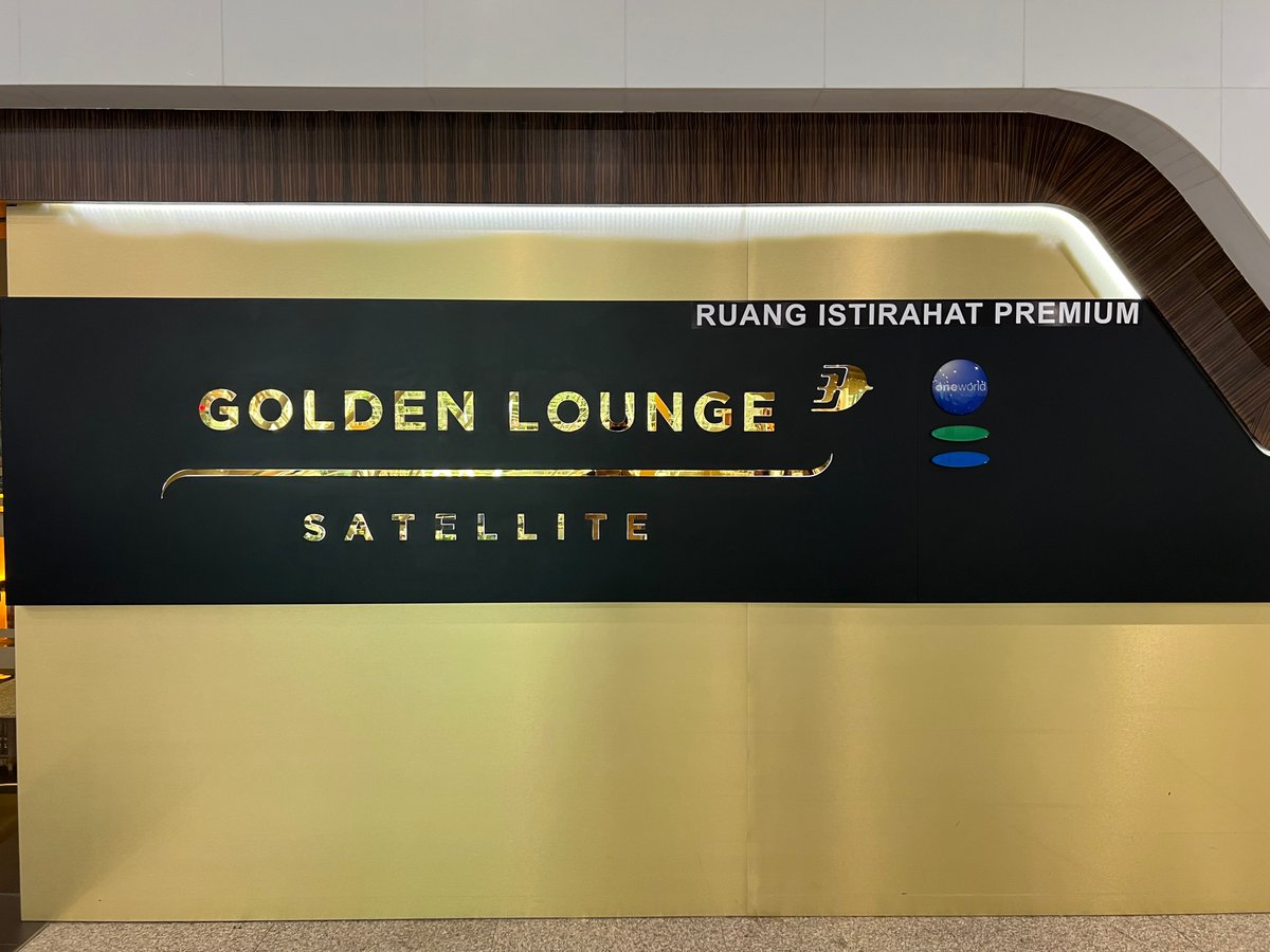 Illuminated entrance sign reading 'GOLDEN LOUNGE' with a