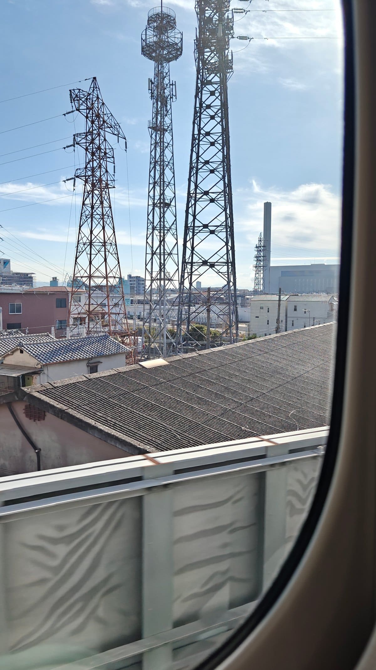 In-transit window view of transmission and telecom towers