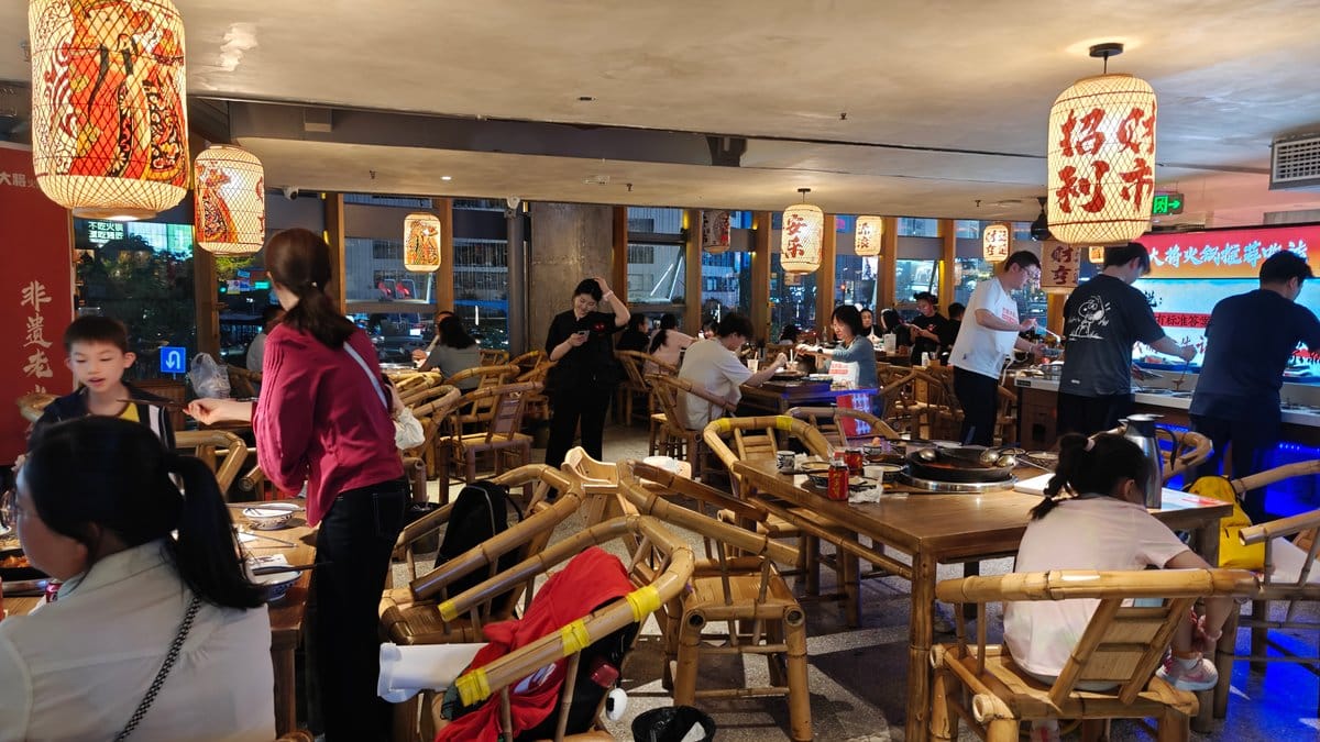 Interior dining room — tables of diners, red