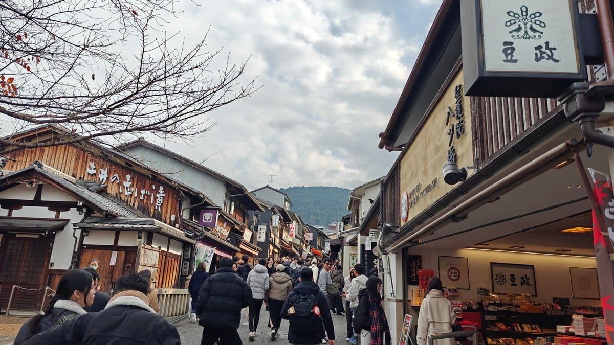 Machiya-lined street cloudy sky