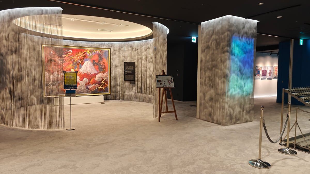 Museum entrance lobby interior with curved stone-textured walls,