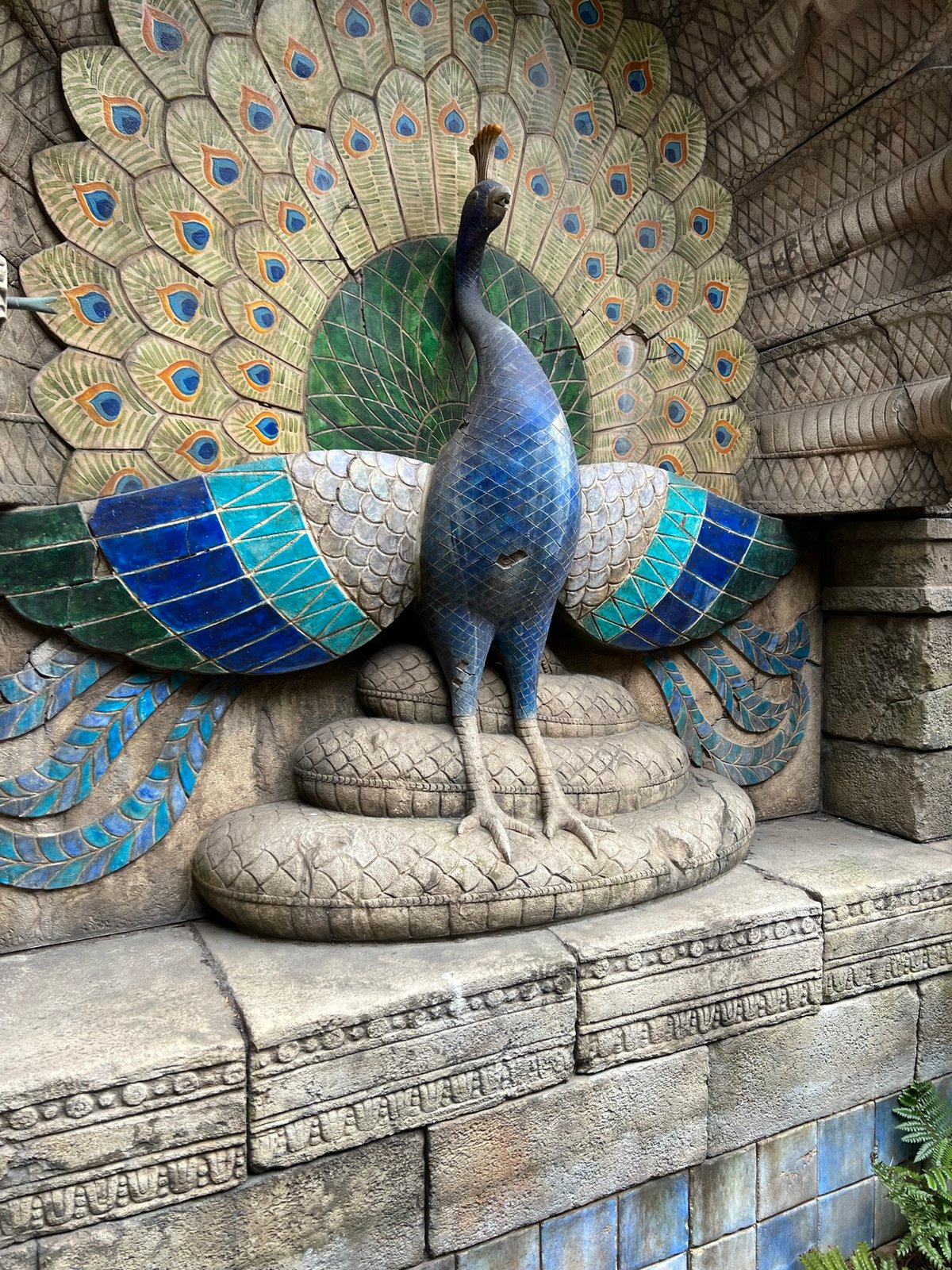 Ornate peacock relief/sculpture in blue-green glazed tilework set