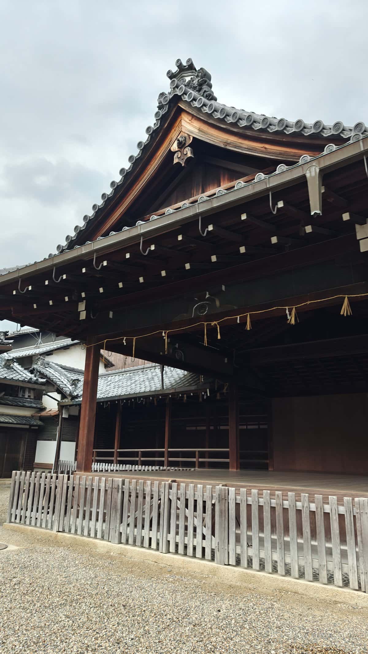 Ornate tiled gable and dark-timber eaves of an