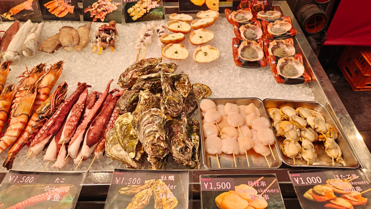 Seafood on ice — octopus legs, oysters, scallop
