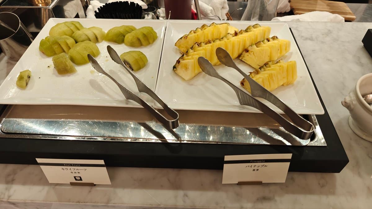 Sliced kiwi fruit and pineapple platters at the