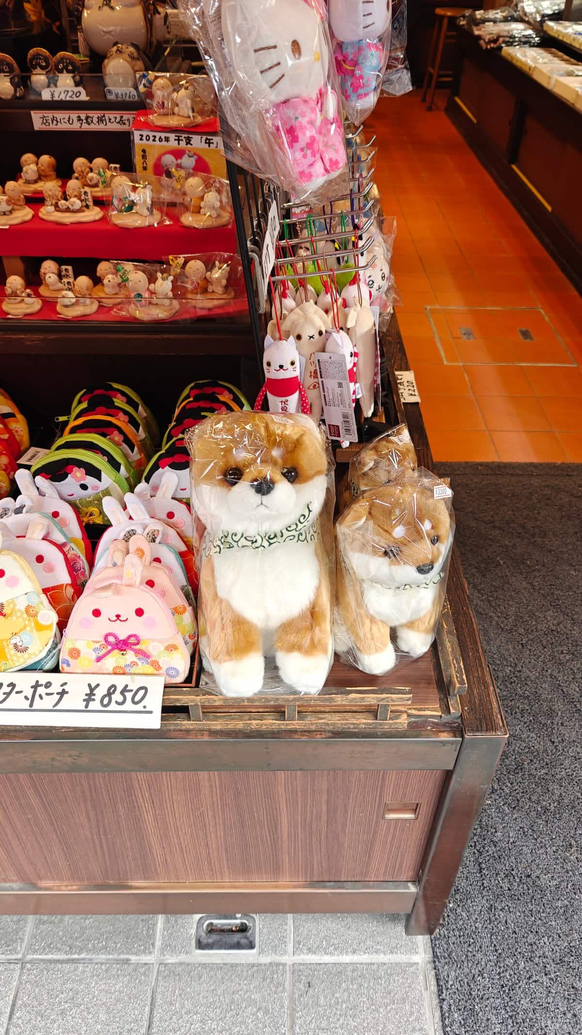 Souvenir display with plush shiba-inu dogs and snacks