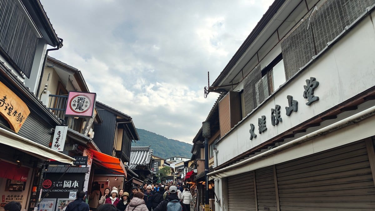 Street scene past a shop with a large