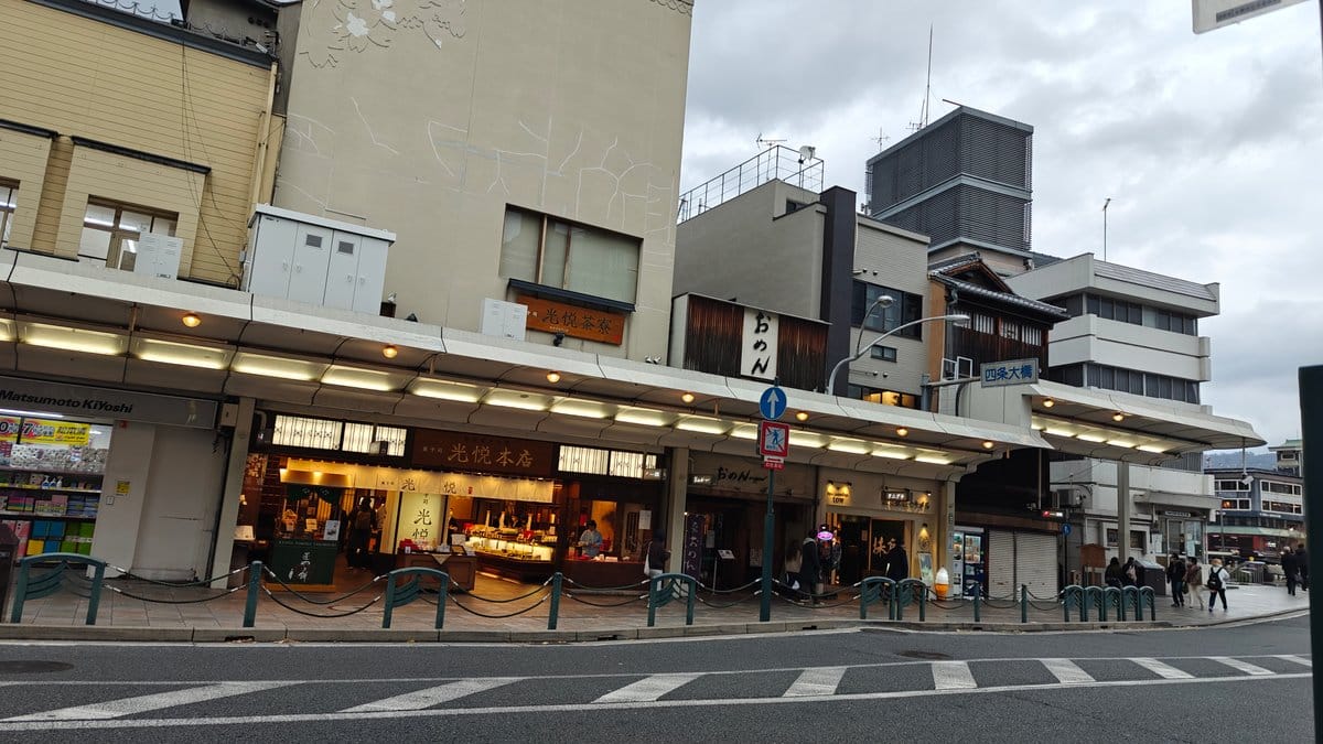 Street with shops and a crossing near the